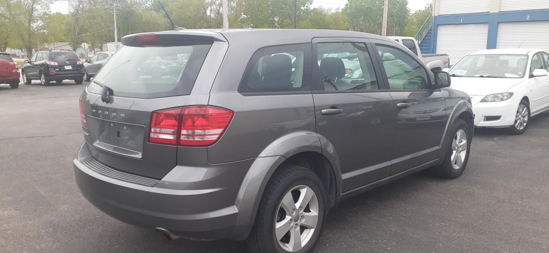 2013 Dodge Journey SE (3C4PDCAB0DT) with an 2.4L L4 DOHC 16V engine, 4-Speed Automatic transmission, located at 2015 Cambell Street, Rapid City, SD, 57701, (605) 342-8326, 44.066433, -103.191772 - CARFAX AVAILABLE - Photo#3